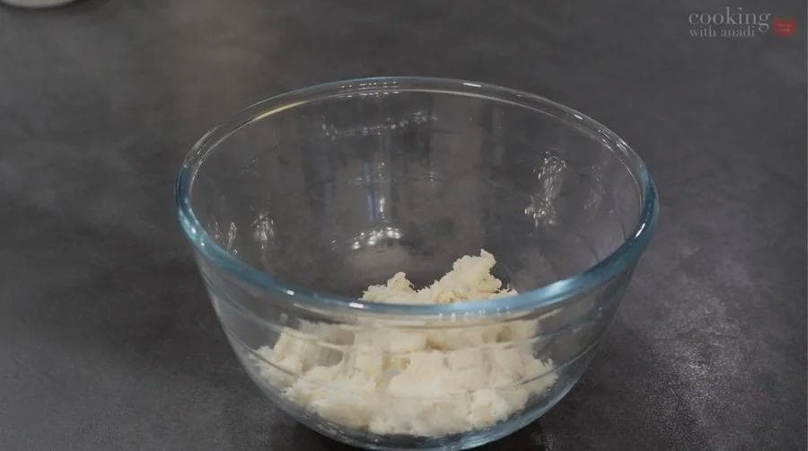 Drained crab meat in a glass mixing bowl ready for combining with other ingredients.
