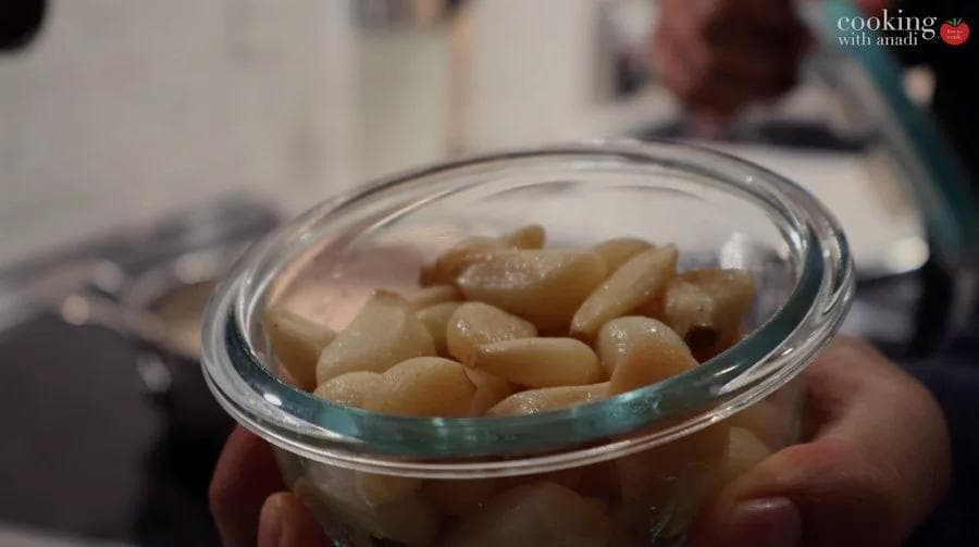 Diced poached chicken in a glass bowl, ready for use in chicken pot pie filling.