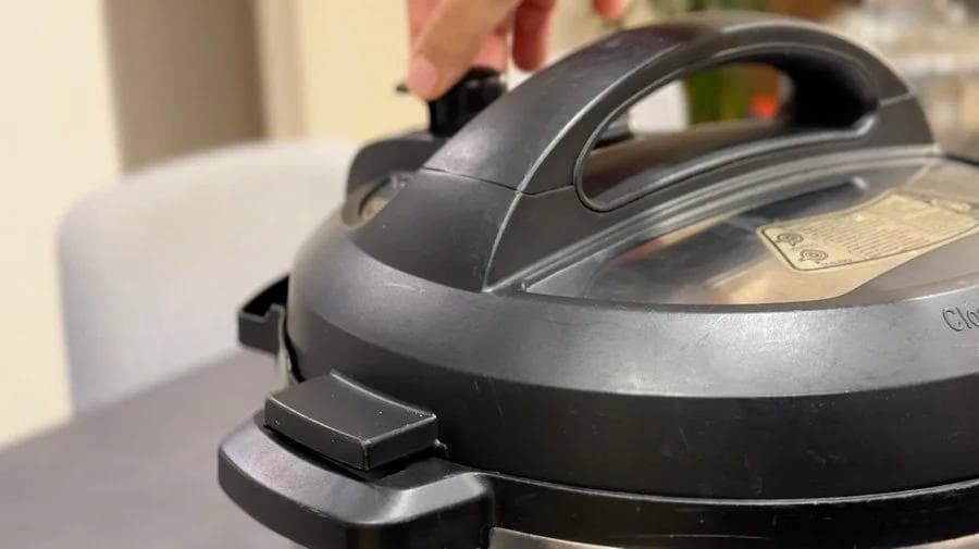 Instant Pot with lid closed in sealing mode, ready for pressure cooking beans for white bean harissa stew.