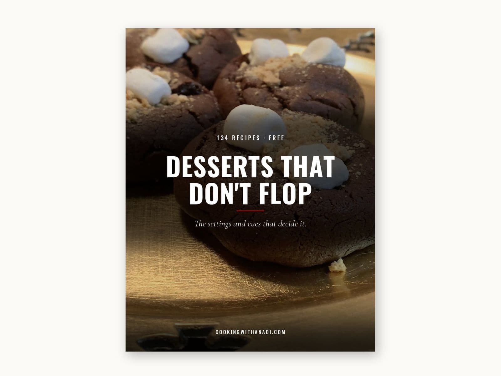 Cover of Desserts That Do Not Flop, over a photograph of chocolate s mores stuffed cookies topped with marshmallows on a gold plate.