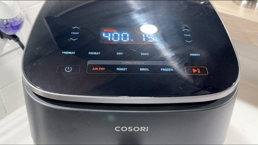 Cosori air fryer display showing 400°F temperature with Air Fry mode selected for cooking tofu.