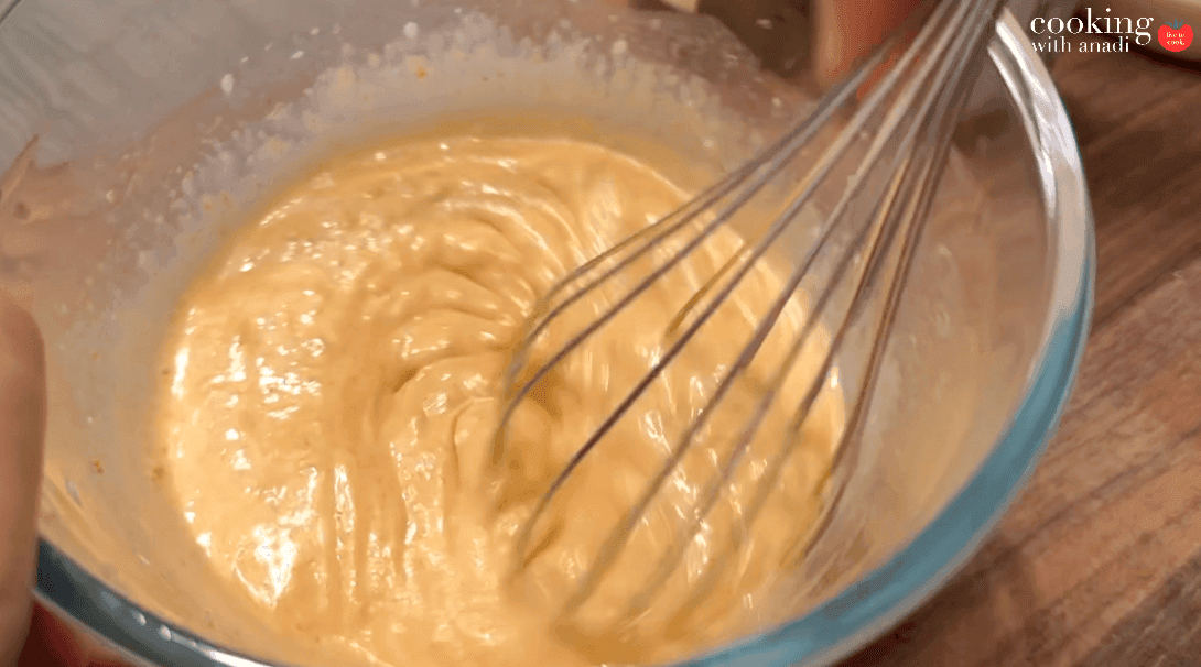 Thai curry mayonnaise being whisked in a bowl until smooth and combined