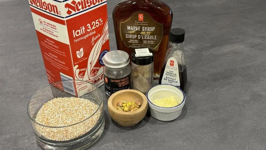 Ingredients for Instant Pot Meetha Dalia: milk, maple syrup, cracked wheat, ghee, cardamom, vanilla extract, and spices.