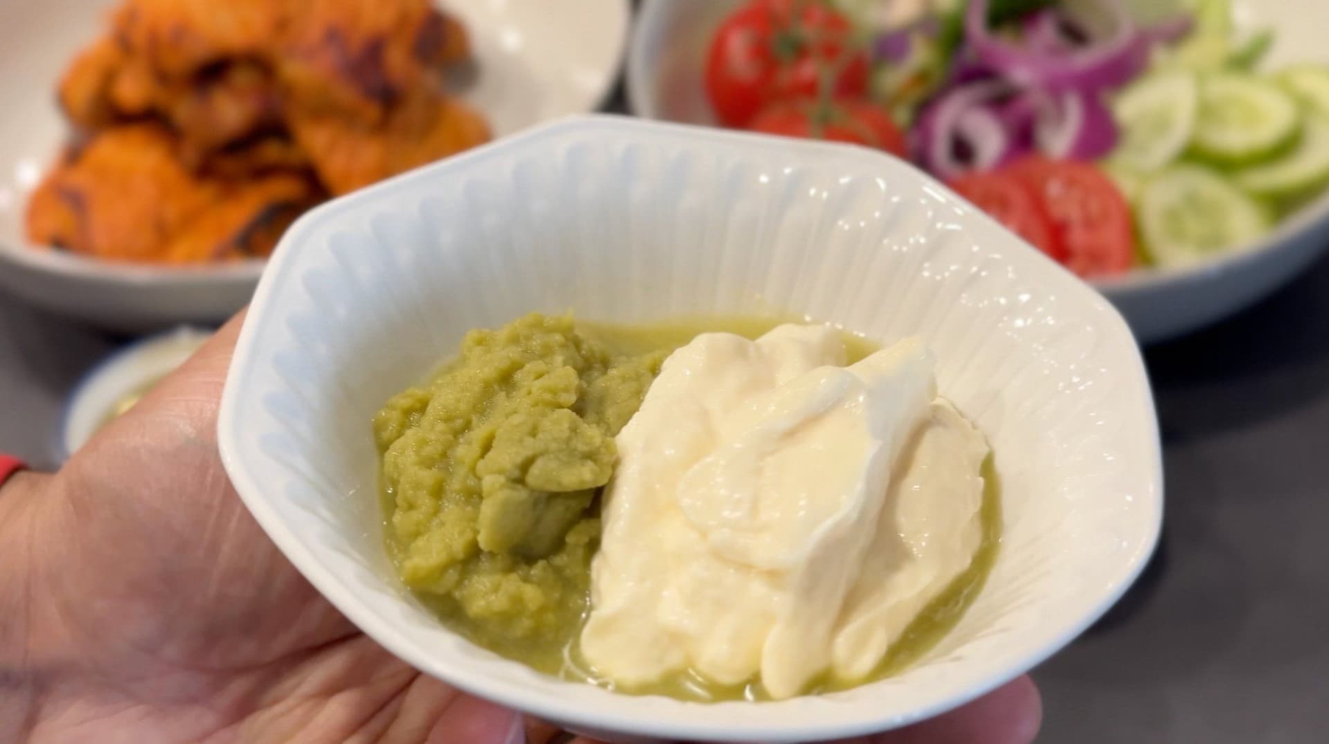 Amla chutney and mayonnaise mixture combined in a white bowl for tandoori chicken sandwich filling.