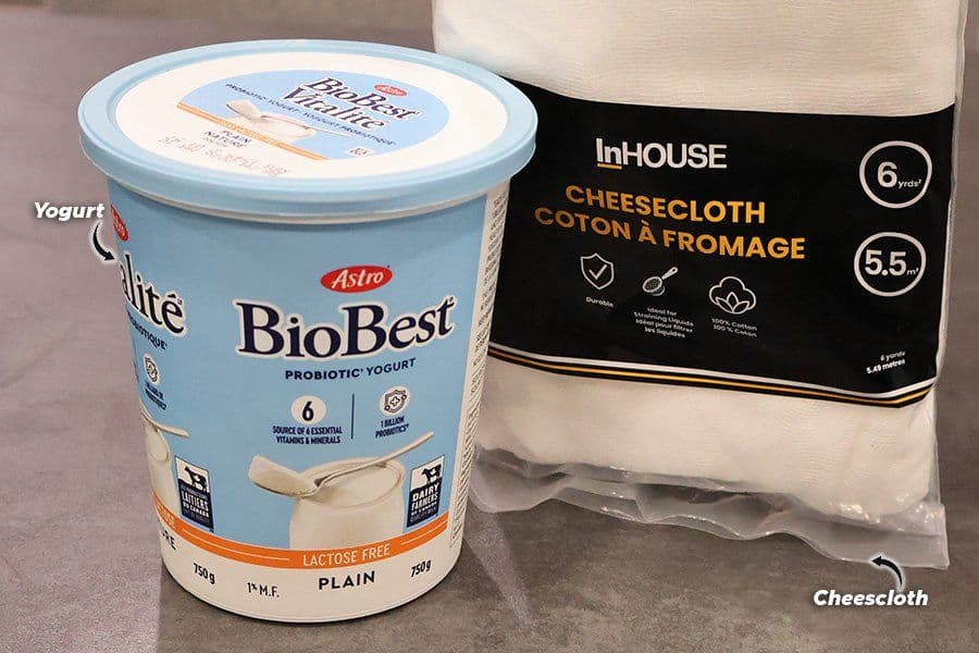 Astro BioBest lactose-free plain yogurt container beside an InHouse cheesecloth package on a gray surface.