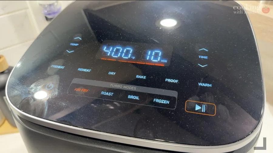 Digital air fryer display showing 400°F temperature setting with various cooking modes visible on the control panel.