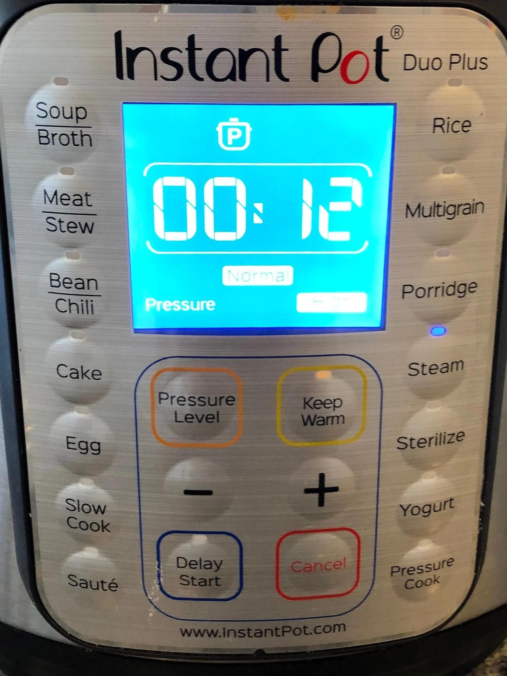 Instant Pot Duo Plus display showing 00:12 cook time on Steam setting for mashed potatoes recipe.