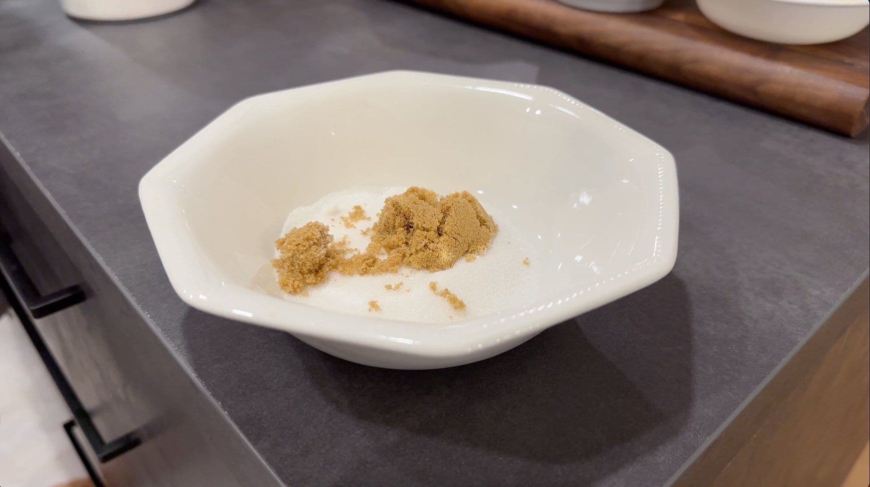 Cinnamon and nutmeg spices mixed together in a white bowl for the egg mixture.