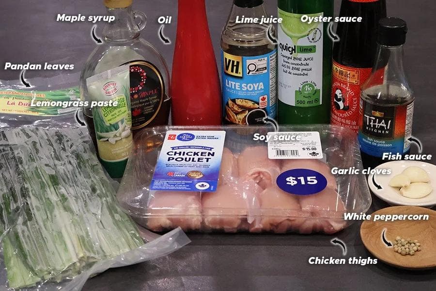 Ingredients for Thai pandan chicken: chicken thighs, pandan leaves, lemongrass paste, soy sauce, oyster sauce, fish sauce, maple syrup, lime juice, garlic, white peppercorn, and oil.