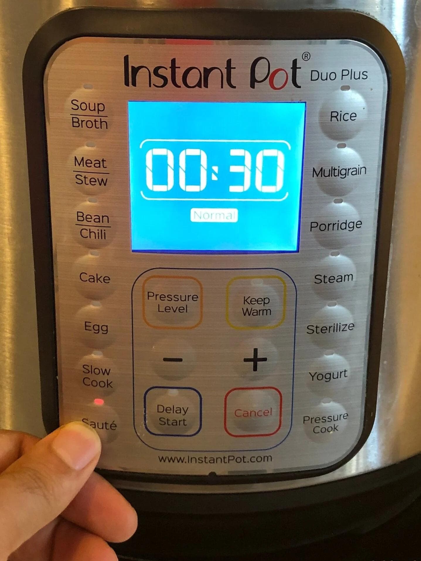 Instant Pot Duo Plus display showing 00:30 timer on Saute mode for cooking masoor dal.