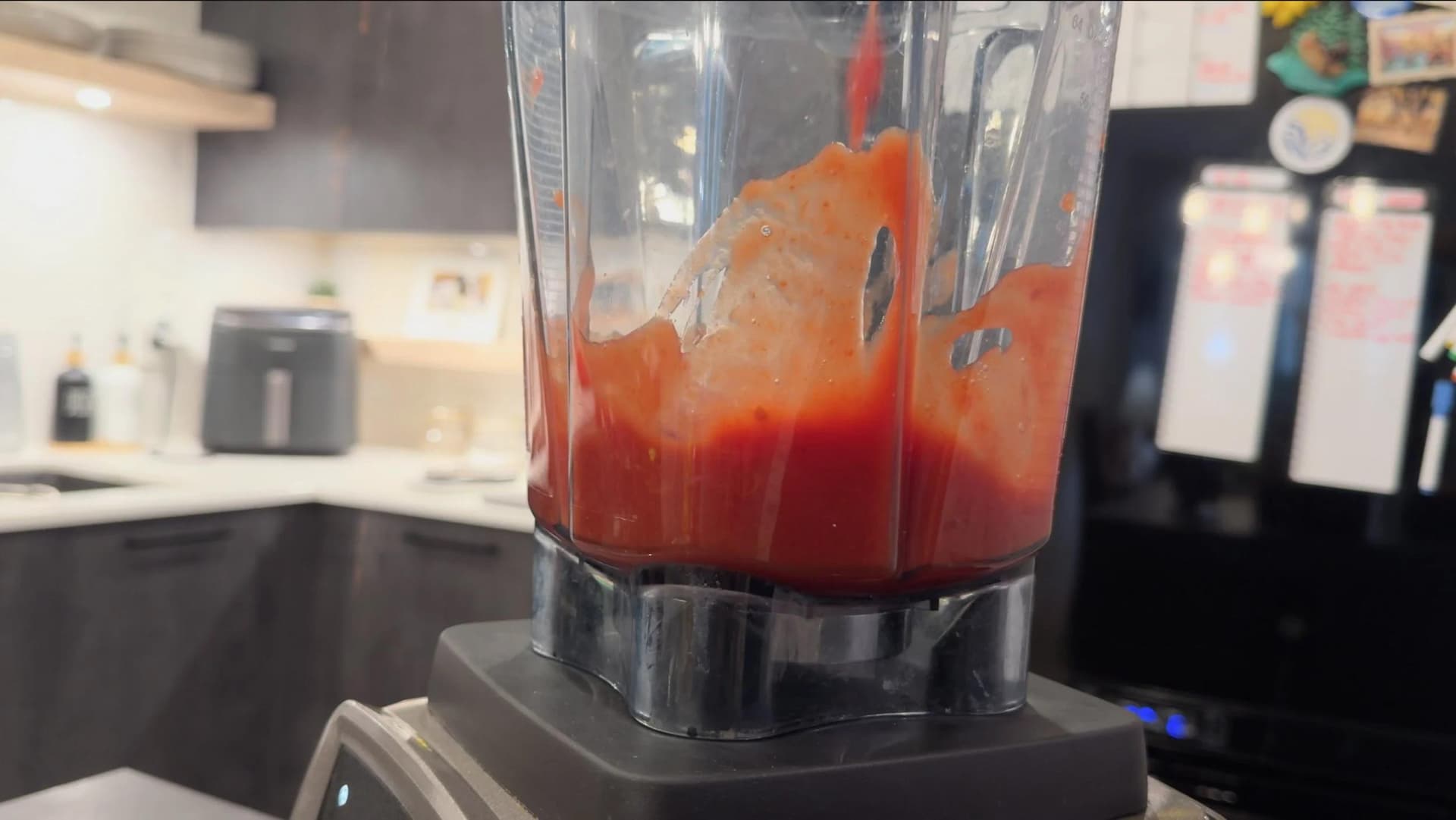 San Marzano tomatoes pulsed into a chunky red sauce inside a blender jar