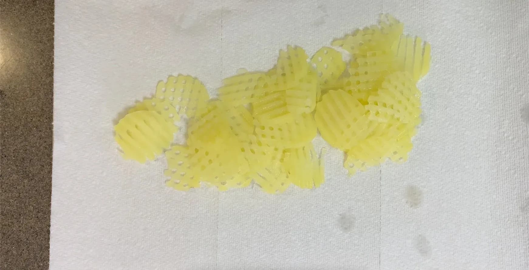 Partially cooked waffle-cut potatoes drained and patted dry on paper towels.